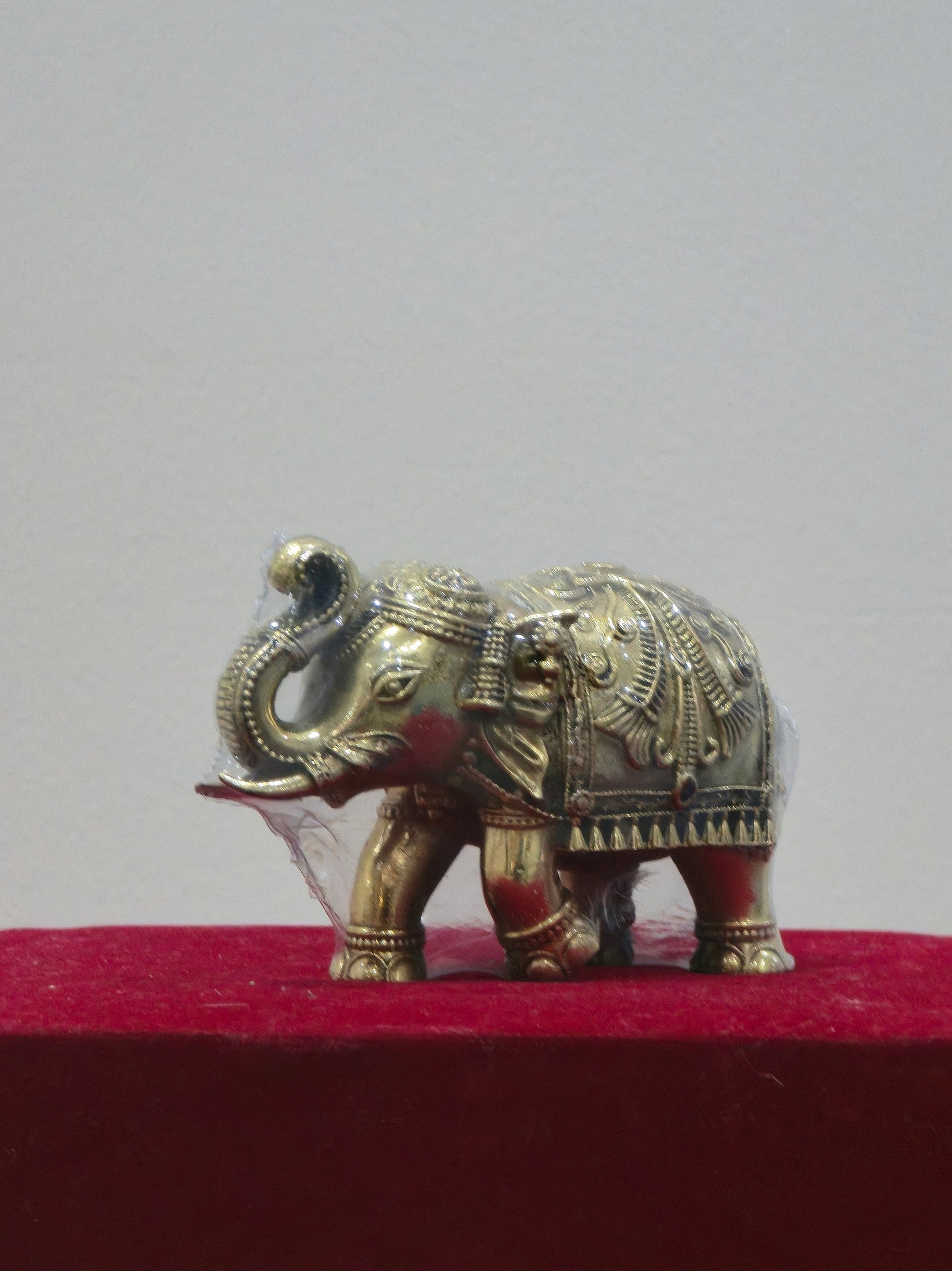 Fully Decorated Elephant with Bell and Upraised Trunk