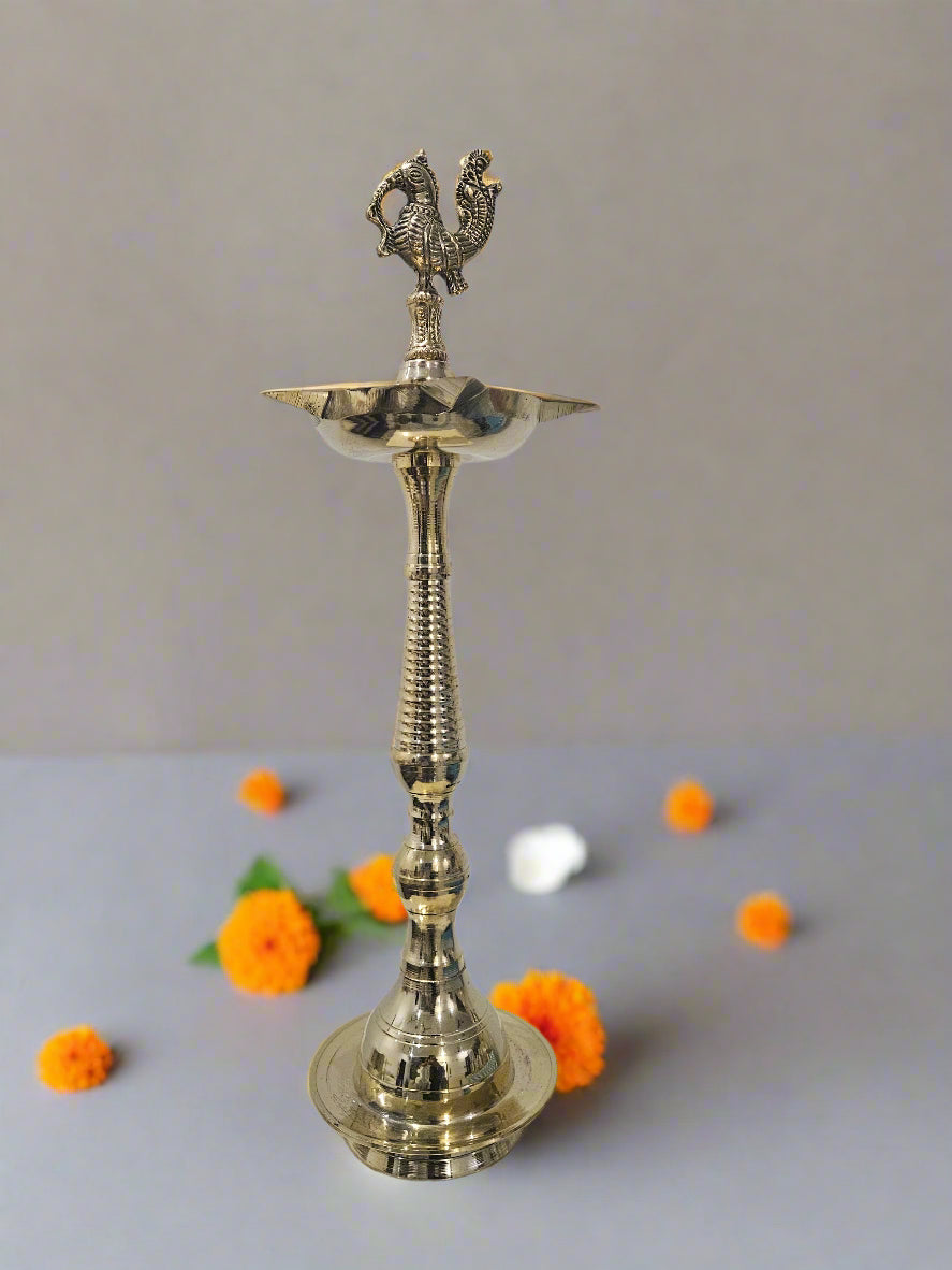 Brass ling diya with peacock head